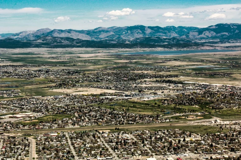 Explore the scenic landscape of Helena, Montana with vast fields and mountain views